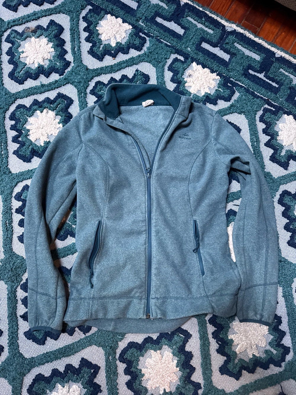 Quechua Women's MH120 Hiking Fleece Jacket features a sweater-knit design and zi